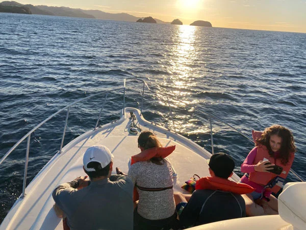 Charter boat leaving the marina at sunrise