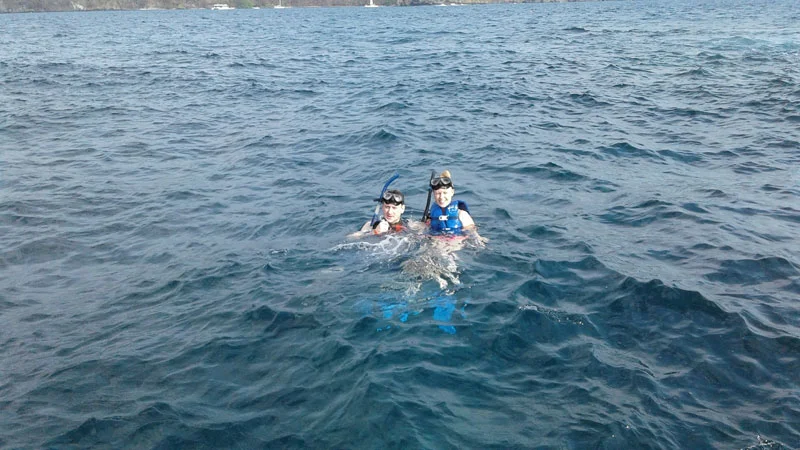 Captain and angler releasing a sailfish at the boat side